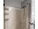 Shower with built-in caddy and black and white striped shower curtain at 104 W County Road 500 S, Clayton, IN 46118