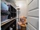 Organized walk-in closet with shelving, hanging rods, and a wicker chair at 104 W County Road 500 S, Clayton, IN 46118