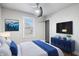Modern bedroom with a sleek bed, ample natural light, and stylish accents at 1829 New St, Indianapolis, IN 46203