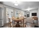 Cozy dining area adjacent to the living room with round table and natural light at 1829 New St, Indianapolis, IN 46203