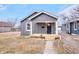 Charming home with a freshly painted exterior, updated front porch, and well-maintained yard at 1829 New St, Indianapolis, IN 46203
