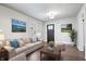 Bright living room with neutral decor, hardwood floors, and decorative artwork at 1829 New St, Indianapolis, IN 46203