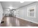 Open living area with hardwood floors connecting to a modern kitchen and dining space at 1829 New St, Indianapolis, IN 46203