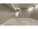 Spacious finished basement with neutral carpeting and recessed lighting at 2016 Central Ave, Indianapolis, IN 46202