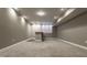 Finished basement with carpeted floors and a wet bar at 2016 Central Ave, Indianapolis, IN 46202