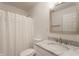 Simple bathroom with white vanity, marble countertop, and shower at 2016 Central Ave, Indianapolis, IN 46202