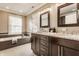 Elegant bathroom with double sinks, granite countertop, and bathtub at 2016 Central Ave, Indianapolis, IN 46202