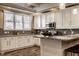 Spacious kitchen featuring granite countertops and white cabinets at 2016 Central Ave, Indianapolis, IN 46202
