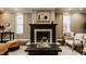 Living room with a fireplace, neutral walls, and comfortable seating at 2016 Central Ave, Indianapolis, IN 46202