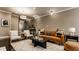 Living room with a leather sofa, armchairs, and stylish coffee table at 2016 Central Ave, Indianapolis, IN 46202