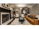 Living room featuring a fireplace, hardwood floors, and comfortable seating at 2016 Central Ave, Indianapolis, IN 46202