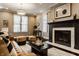 Open living room with a fireplace, stylish decor, and comfortable seating at 2016 Central Ave, Indianapolis, IN 46202