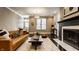 Living room featuring a leather sofa, coffee table, and neutral decor at 2016 Central Ave, Indianapolis, IN 46202