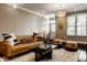 Spacious living room with leather couch and decorative pillows at 2016 Central Ave, Indianapolis, IN 46202
