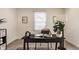 Home office with a desk, chair, and large window with blinds at 2016 Central Ave, Indianapolis, IN 46202