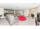 Finished basement with stone fireplace, grey sofa, carpet, and desk space at 8528 Quail Hollow Rd, Indianapolis, IN 46260