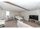 Basement bedroom with carpet, bed, TV on stand, dresser, and window at 8528 Quail Hollow Rd, Indianapolis, IN 46260