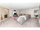 Finished basement featuring a stone fireplace, carpet, grey sofa, and decor at 8528 Quail Hollow Rd, Indianapolis, IN 46260