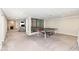 Spacious finished basement featuring a ping pong table, carpet and stone fireplace at 8528 Quail Hollow Rd, Indianapolis, IN 46260