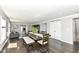 Open-concept layout featuring a dining area with hardwood floors leading to a living area at 8528 Quail Hollow Rd, Indianapolis, IN 46260
