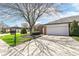 Charming brick home featuring an attached two-car garage and well-maintained landscaping at 8528 Quail Hollow Rd, Indianapolis, IN 46260