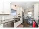 Well-lit kitchen featuring a stainless steel sink, granite countertops and stainless steel appliances at 8528 Quail Hollow Rd, Indianapolis, IN 46260