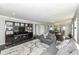 Spacious living area featuring hardwood floors and a large television at 8528 Quail Hollow Rd, Indianapolis, IN 46260