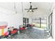 Light-filled sunroom with slate floors, vaulted ceiling, and access to the backyard at 8528 Quail Hollow Rd, Indianapolis, IN 46260