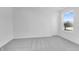 Bedroom showcasing gray carpet, white walls, a door and a window with a natural view at 1095 Bevy Blvd, Danville, IN 46122