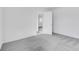 Neutral bedroom with gray carpet and a doorway leading to another room at 1095 Bevy Blvd, Danville, IN 46122