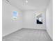 Clean, minimalist bedroom featuring gray carpet, neutral paint and a sunlit window at 1095 Bevy Blvd, Danville, IN 46122