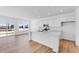 Bright kitchen showcasing a large island, white cabinets and marble countertops, adjacent to the dining area at 1095 Bevy Blvd, Danville, IN 46122