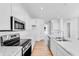 Contemporary kitchen with stainless steel appliances, white cabinets and marble countertops at 1095 Bevy Blvd, Danville, IN 46122
