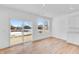 Sunny living space with sliding glass doors and windows overlooking the backyard at 1095 Bevy Blvd, Danville, IN 46122