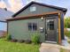 Charming home featuring unique shake siding, updated gutters and a well-maintained front yard at 1621 Draper St, Indianapolis, IN 46203