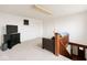 Spacious room featuring modern black TV console and a cozy seating area by the stairway at 26735 Six Points Rd, Sheridan, IN 46069