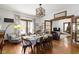 Elegant dining room with a large table, and views into the living room at 26735 Six Points Rd, Sheridan, IN 46069