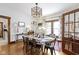 Bright dining area featuring a table with seating for six and hardwood floors at 26735 Six Points Rd, Sheridan, IN 46069