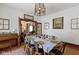 Charming dining room with rustic table, chairs, and a view to the living room at 26735 Six Points Rd, Sheridan, IN 46069