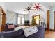 Living room with hardwood floors, comfortable seating, and a Christmas tree at 26735 Six Points Rd, Sheridan, IN 46069