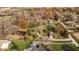 Aerial perspective of homes with mature trees and lush landscaping, highlighting a private and tranquil setting at 5528 Lincoln Rd, Martinsville, IN 46151