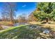 Scenic pond view with a dock, fire pit, and lush green surroundings, perfect for relaxation and outdoor enjoyment at 5528 Lincoln Rd, Martinsville, IN 46151