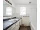 Bathroom features vanity, sink, mirror, and window at 825 Arrow Ave, Anderson, IN 46016