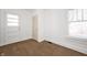 Bright bedroom features large windows and carpet at 825 Arrow Ave, Anderson, IN 46016