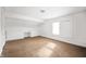 Bright bedroom features large windows, carpet, and built-in storage at 825 Arrow Ave, Anderson, IN 46016