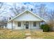 Quaint one-story home with a cozy covered porch and a classic design at 825 Arrow Ave, Anderson, IN 46016