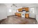 Functional kitchen featuring light wood cabinets, white appliances, and tiled backsplash at 825 Arrow Ave, Anderson, IN 46016