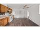 Bright kitchen features wood cabinets, stove, and modern tile backsplash at 825 Arrow Ave, Anderson, IN 46016