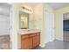 Bathroom vanity with neutral colors and a glimpse of a bedroom in the background at 10034 Evening Sun Ct, Avon, IN 46123