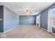 Spacious bedroom with two large windows with curtains, and neutral carpet at 10034 Evening Sun Ct, Avon, IN 46123
